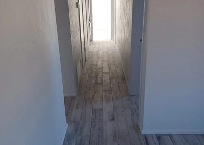 Red's Remodeling & Handyman - Hallway remodel including new tile floors.